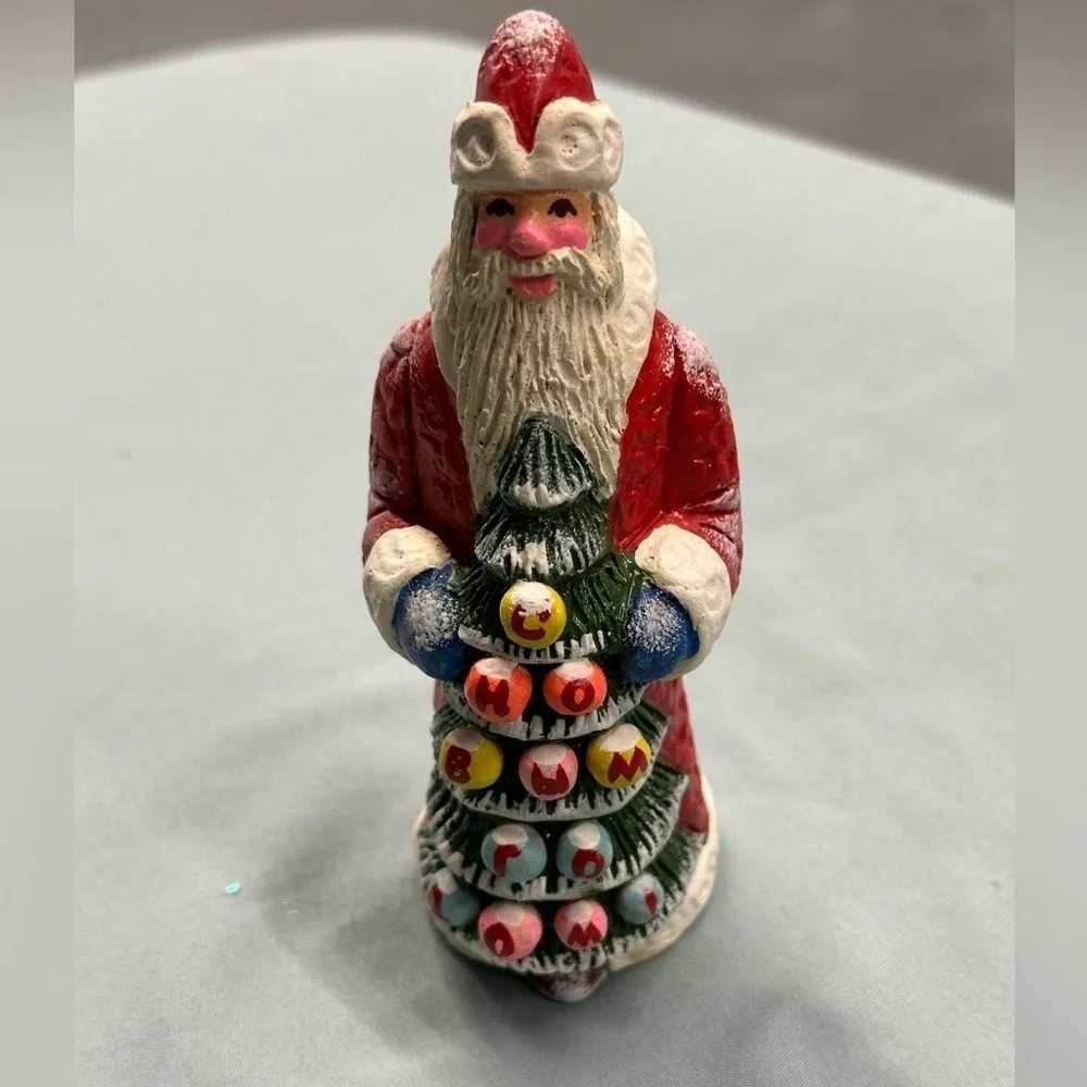 Resin Santa figure carries a special greeting